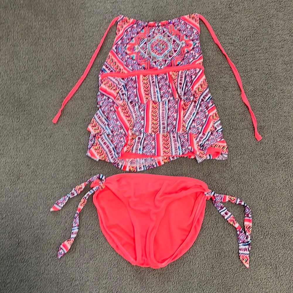 Pink swimsuit with lots if details and other colors.